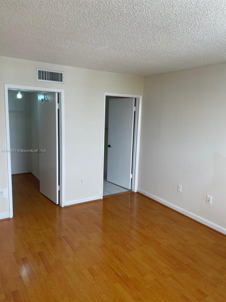 8251 Northwest 8th Street, Unit 414 Miami, FL 33126 - Photo 8 of 25 a view of an empty room