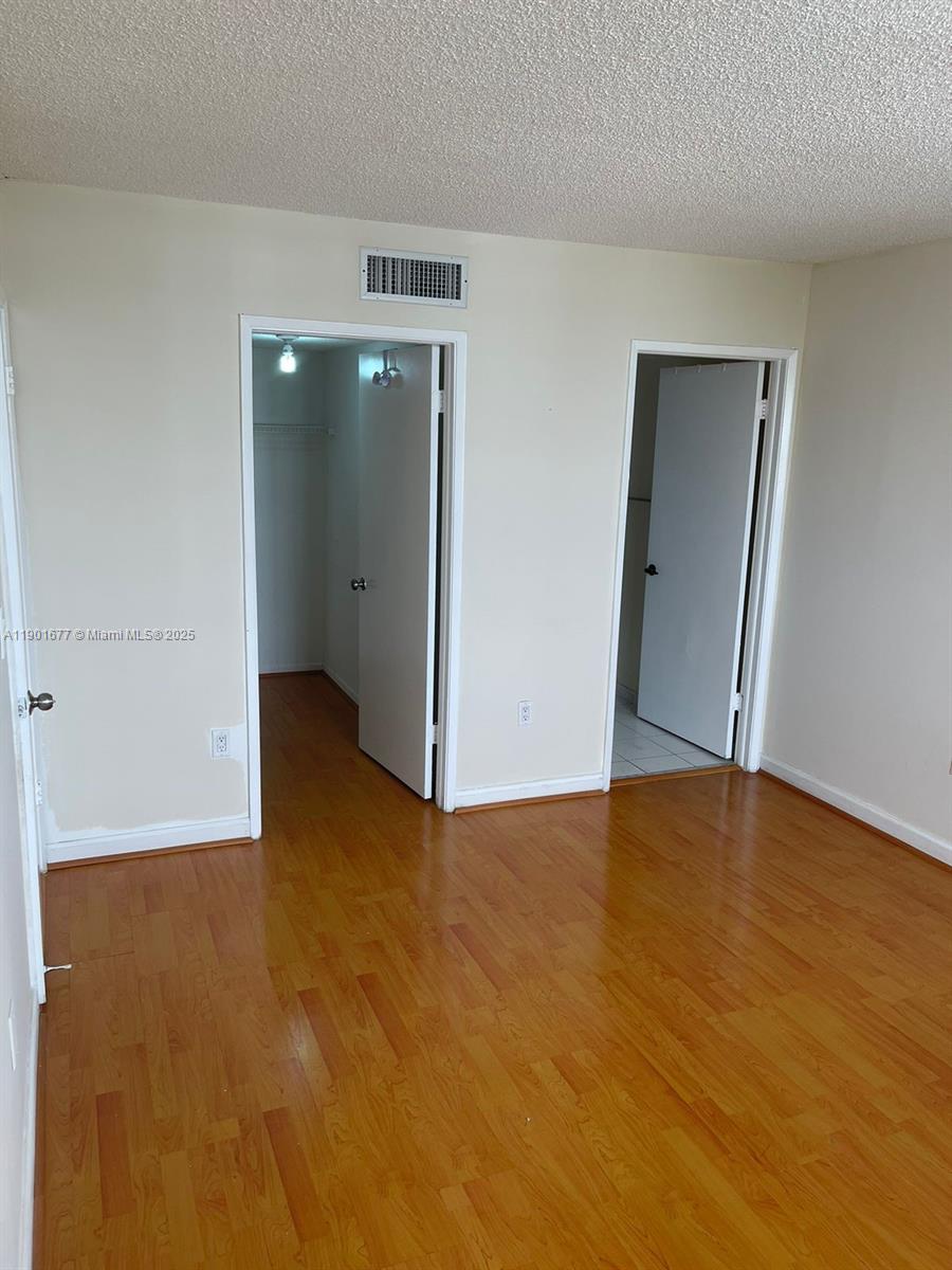 8251 Northwest 8th Street, Unit 414 Miami, FL 33126 - Photo 9 of 25 a view of an empty room