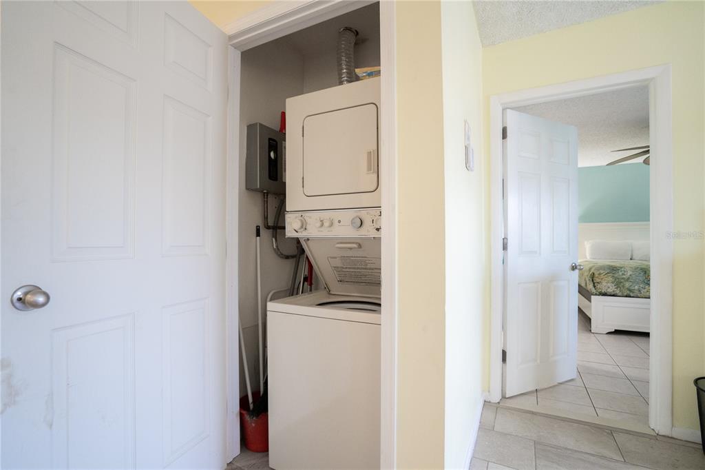 230 Medallion Boulevard, Unit E Madeira Beach, FL 33708 - Photo 19 of 35 a utility room with dryer and washer