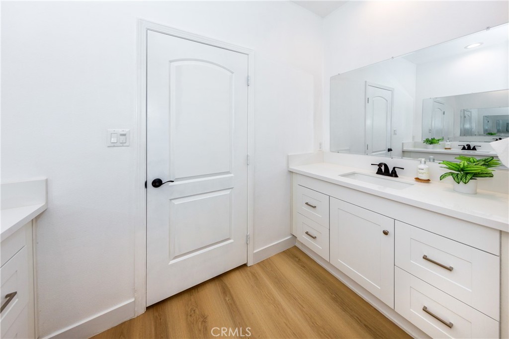 26210 Larkhaven Place Newhall, CA 91321 - Photo 21 of 29 a bathroom with a sink and a mirror