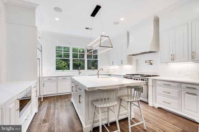 a bedroom with furniture and a large window