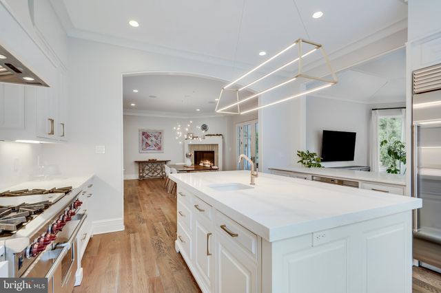 a utility room with sink dryer and washer