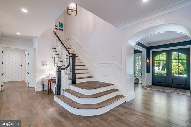 a living room with furniture a rug and a window