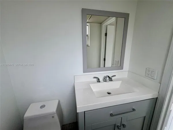 a bathroom with a sink and a toilet