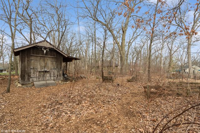 a house with trees in the background