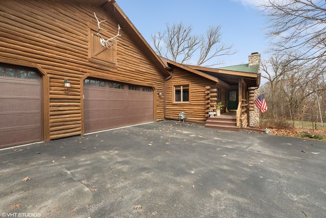a view of a house with a garage