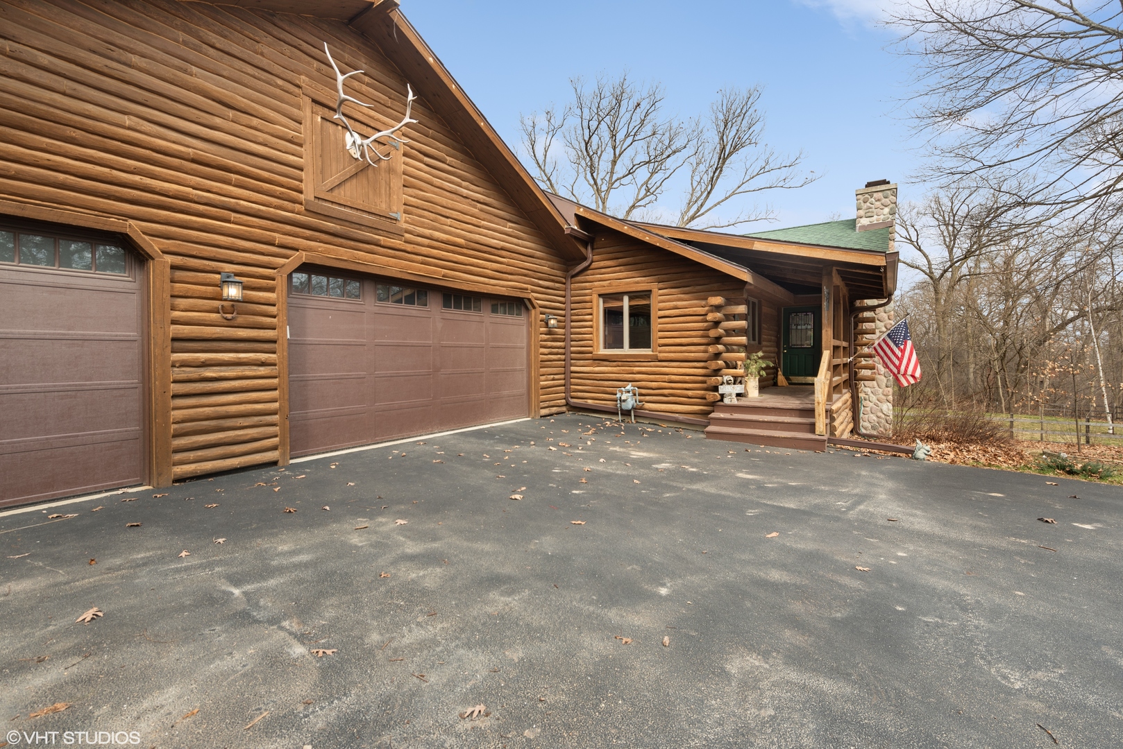 N1519 Fair Oaks Road Lake Geneva, WI 53147 - Photo 2 of 16 a view of a house with a garage