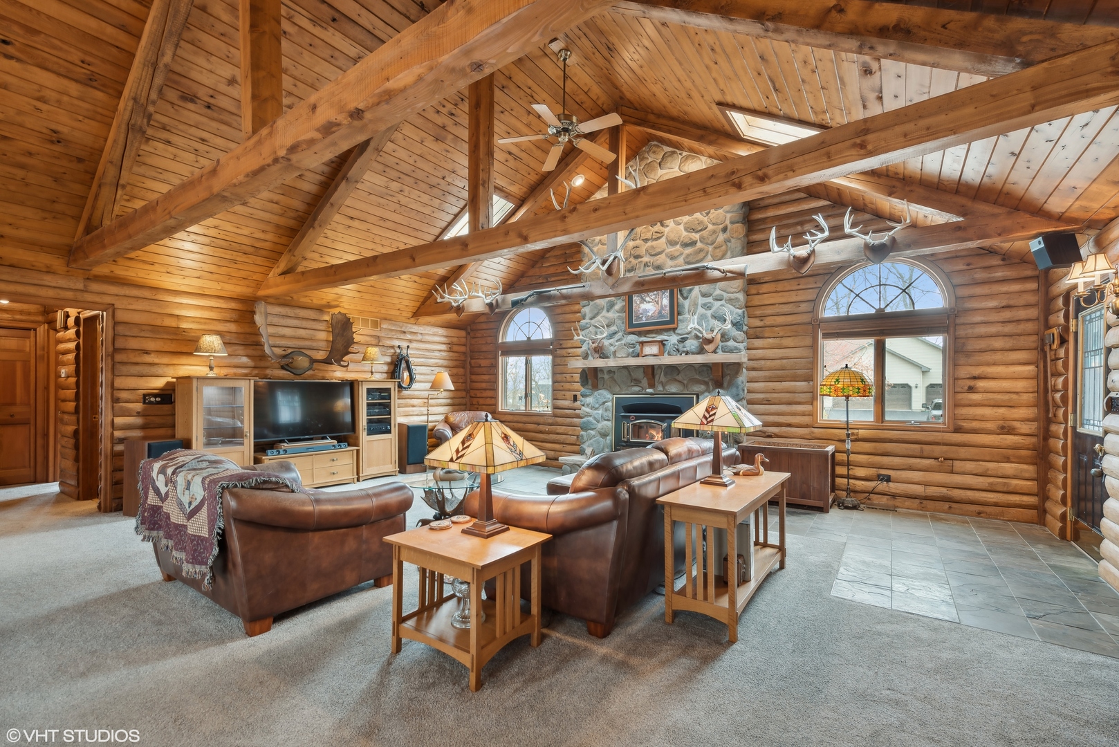N1519 Fair Oaks Road Lake Geneva, WI 53147 - Photo 3 of 16 a living room with furniture and a flat screen tv