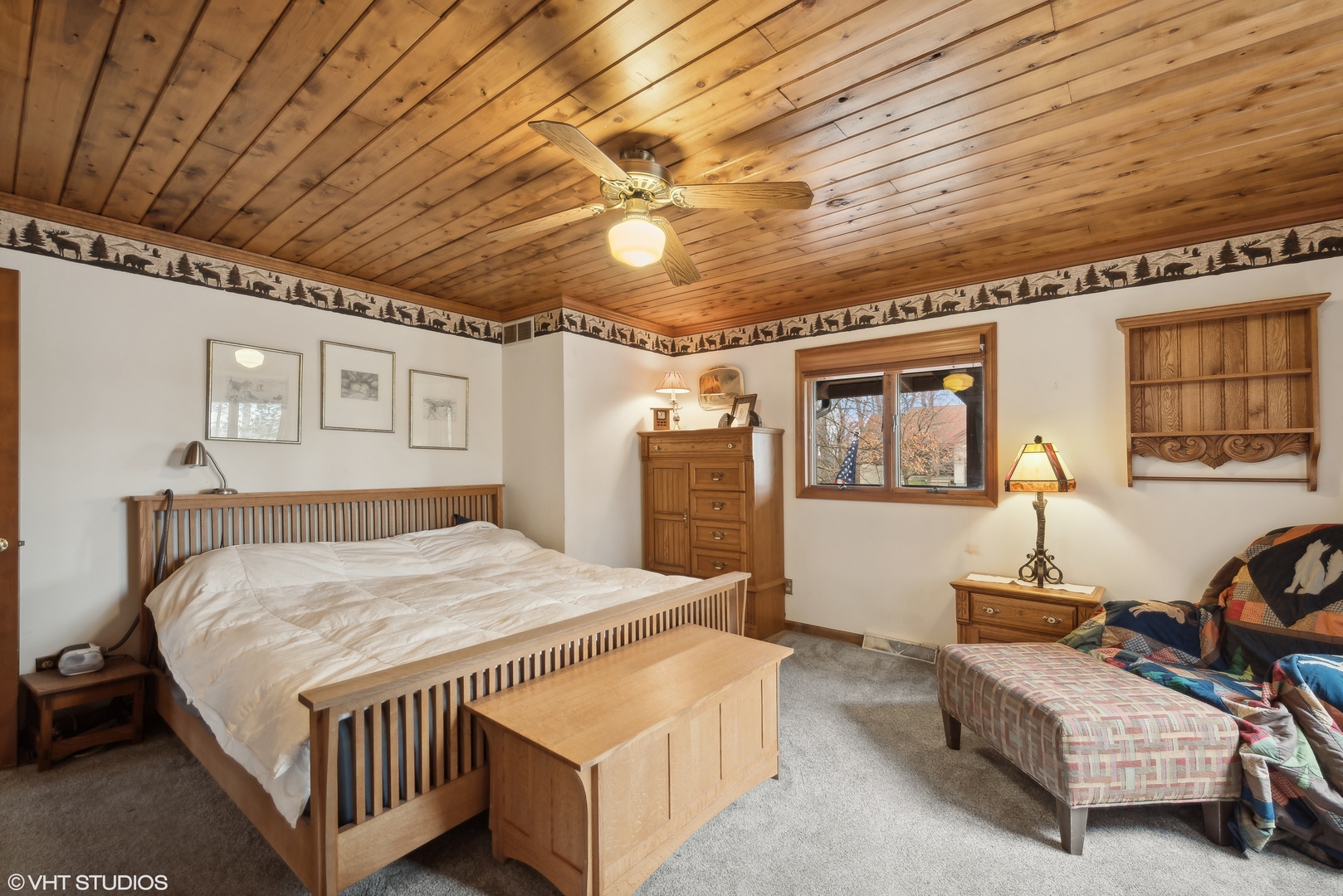 N1519 Fair Oaks Road Lake Geneva, WI 53147 - Photo 6 of 16 a bedroom with a bed and wooden floor