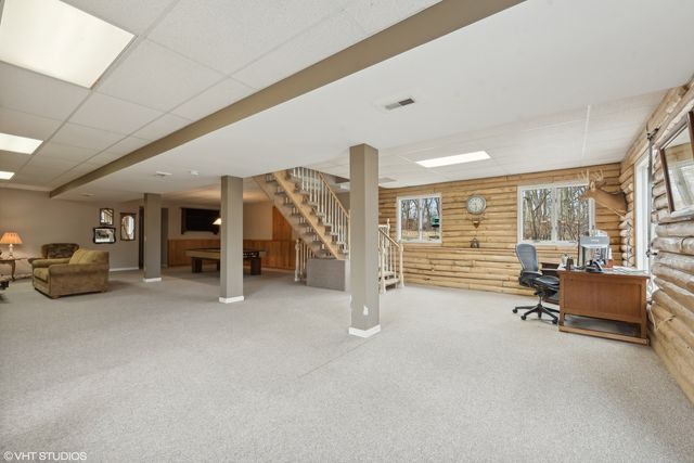 a view of a livingroom with furniture and a window