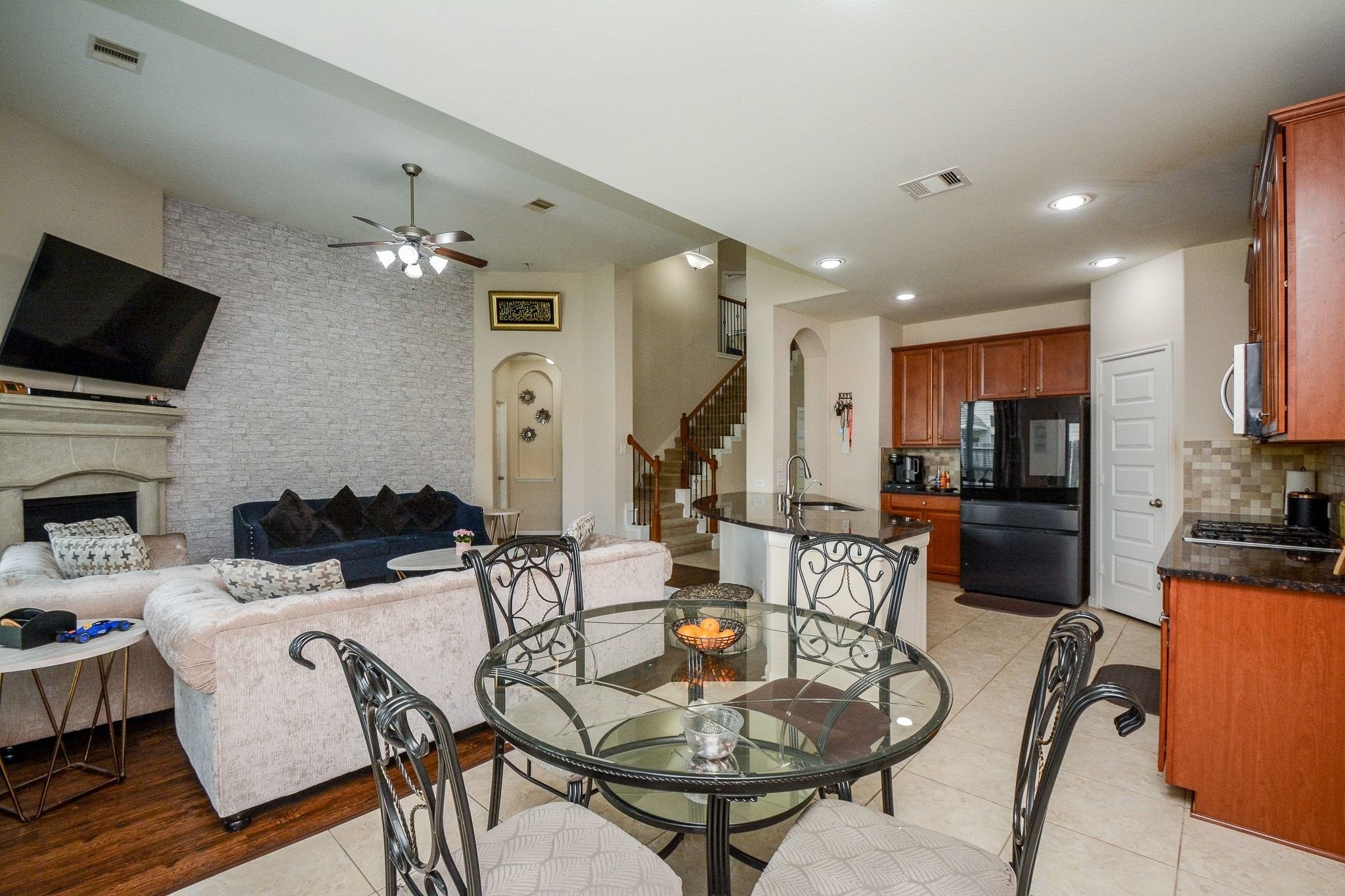 7046 Sliding Rock Circle Spring, TX 77379 - Photo 10 of 41 Charming breakfast nook with a stylish table, seamlessly connecting to the open living and kitchen areas for a cozy and inviting atmosphere.