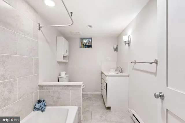 a kitchen with stainless steel appliances a sink and a refrigerator
