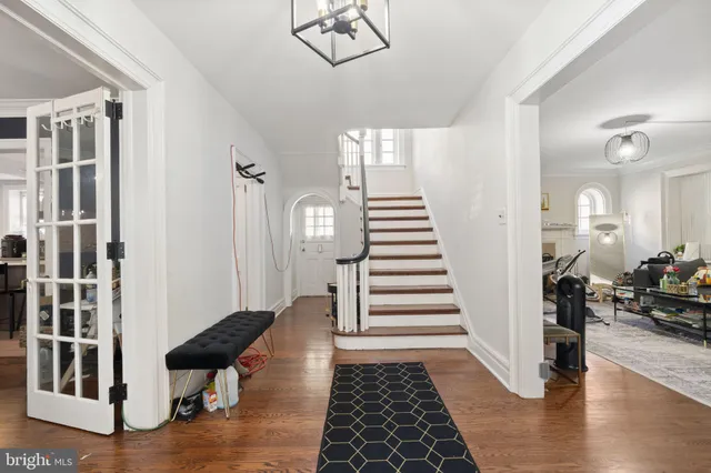 a view of staircase with white walls and a window