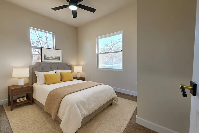 a bedroom with a bed and window