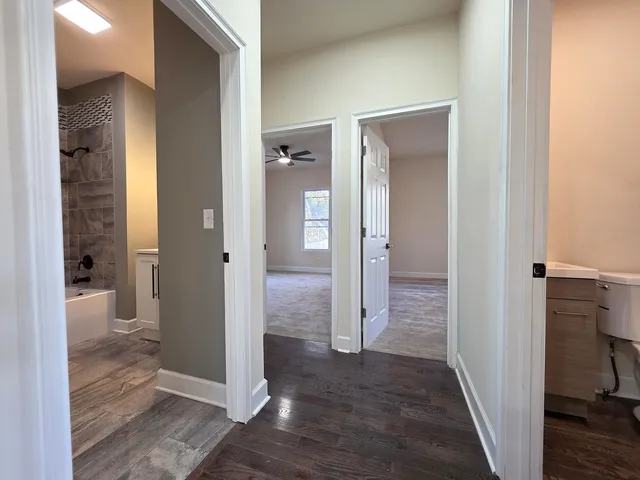 a view of a bathroom with tub and shower