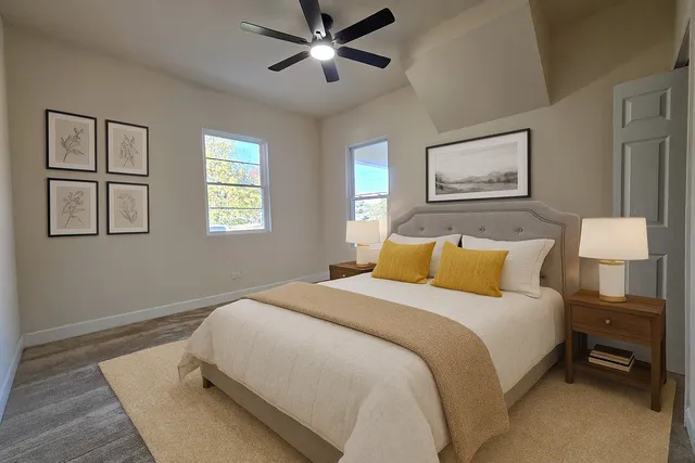 a bedroom with beds and a window