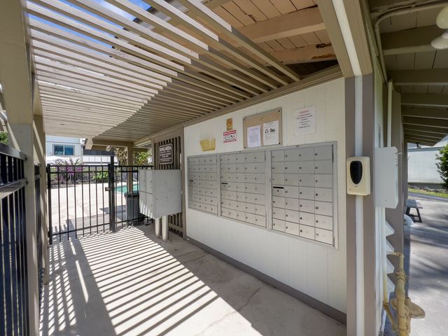 a view of a balcony with wooden floor