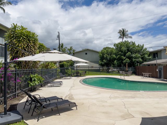 a view of a backyard with sitting area