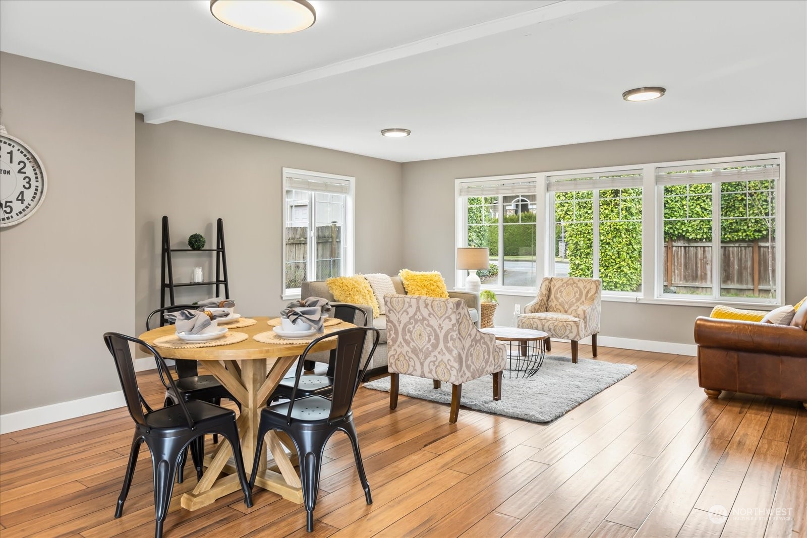 24231 23rd Avenue Southeast Bothell, WA 98021 - Photo 12 of 40 a view of a dining room with furniture window and wooden floor