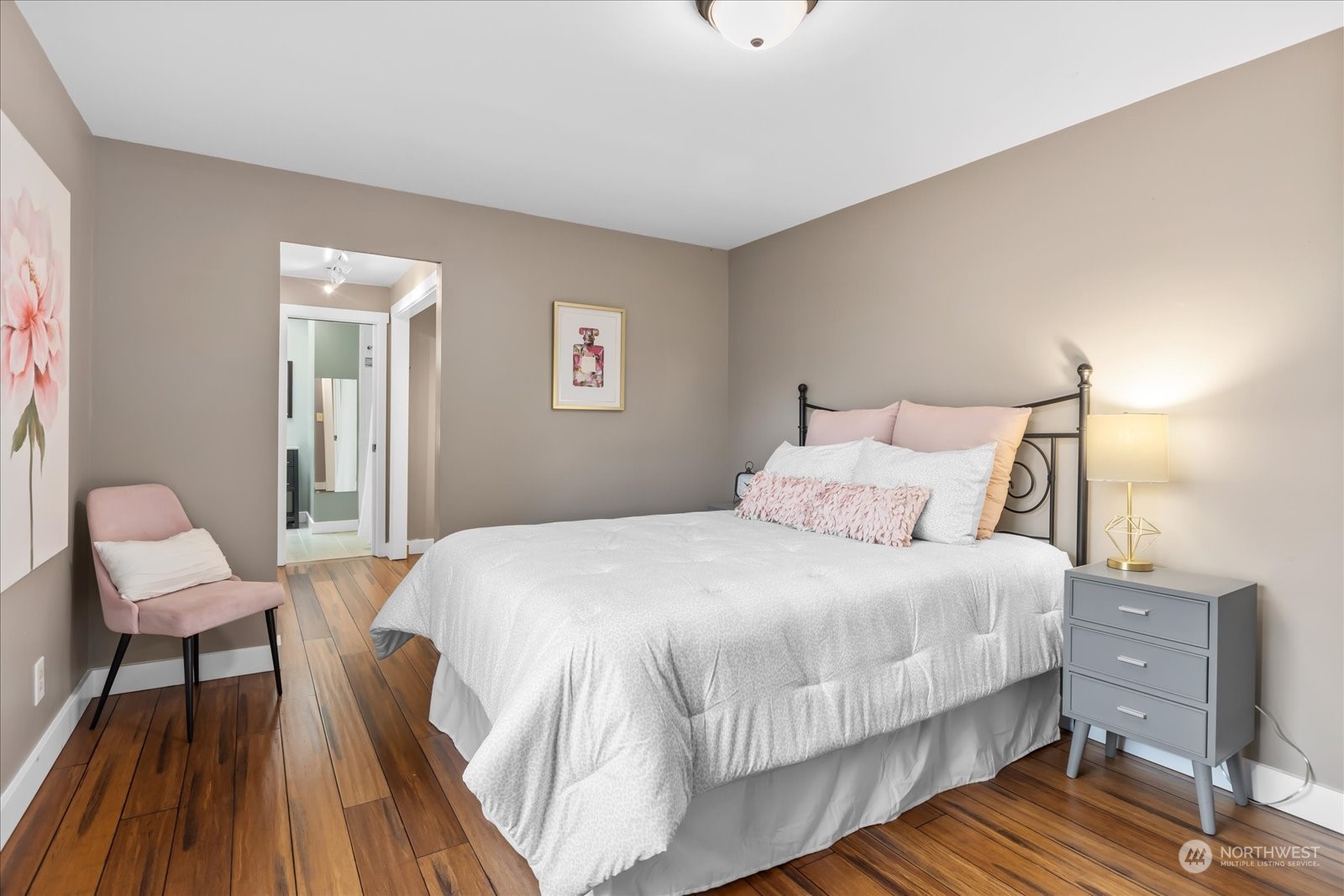 24231 23rd Avenue Southeast Bothell, WA 98021 - Photo 16 of 40 a bedroom with a bed and wooden floor