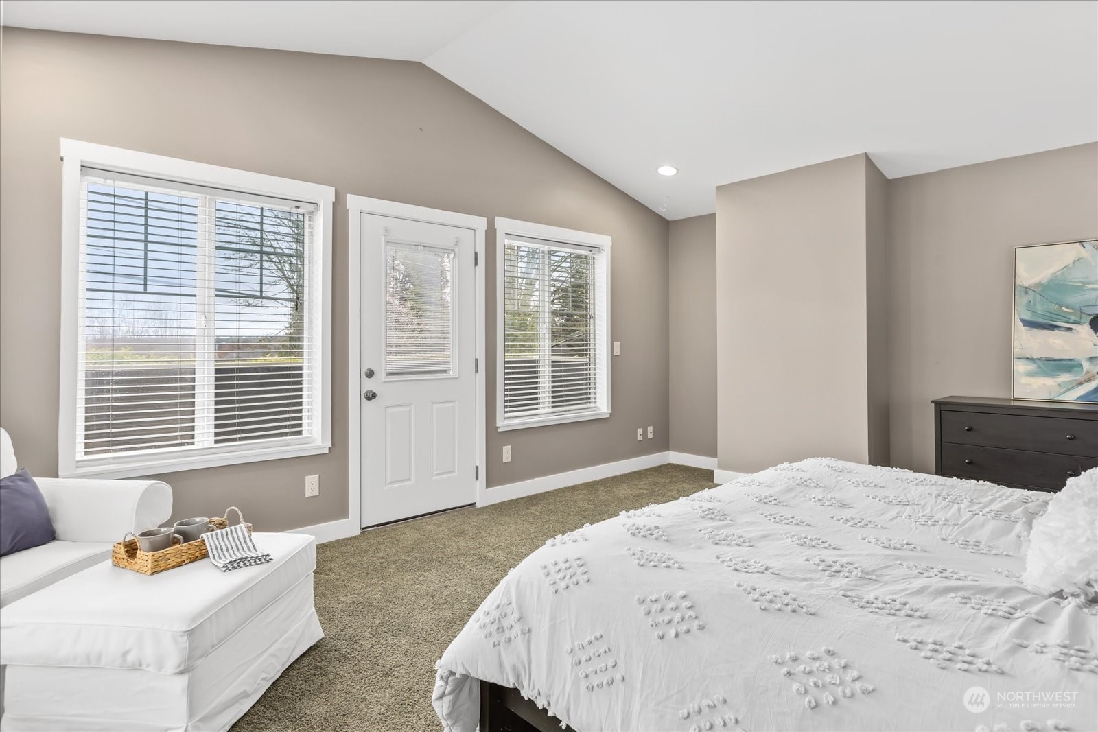 24231 23rd Avenue Southeast Bothell, WA 98021 - Photo 19 of 40 a bedroom with a bed and large windows