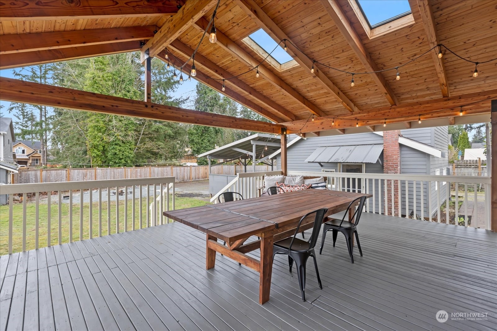 24231 23rd Avenue Southeast Bothell, WA 98021 - Photo 25 of 40 a view of a roof deck with table and chairs with wooden floor
