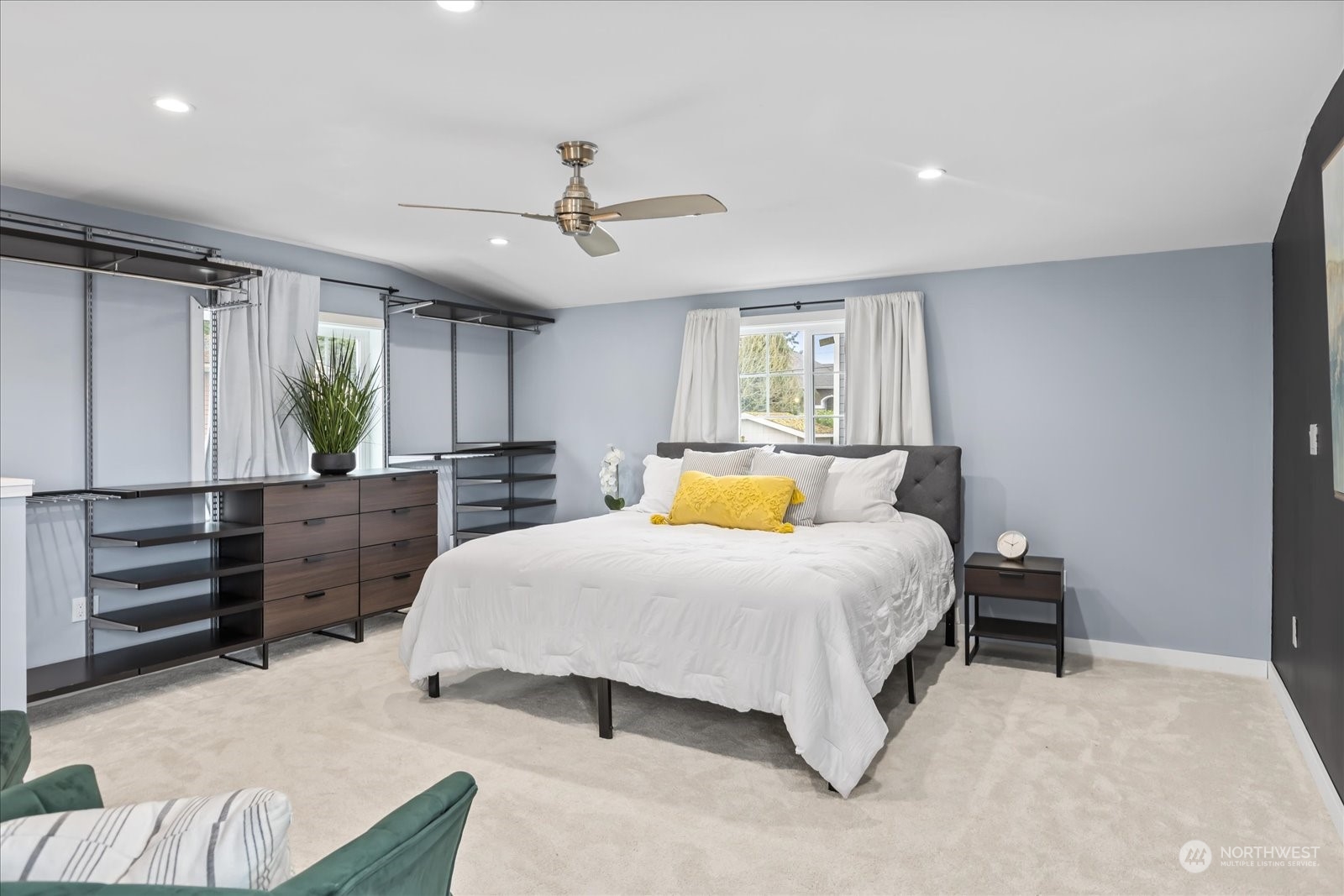 24231 23rd Avenue Southeast Bothell, WA 98021 - Photo 31 of 40 a bedroom with a large bed and ceiling fan