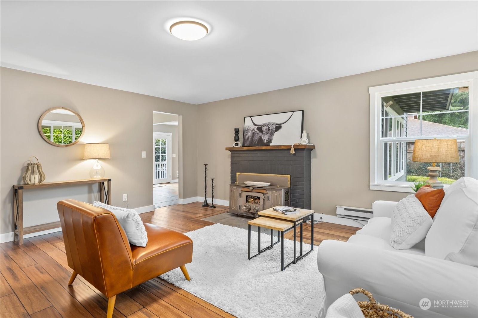 24231 23rd Avenue Southeast Bothell, WA 98021 - Photo 4 of 40 a living room with furniture and a fireplace