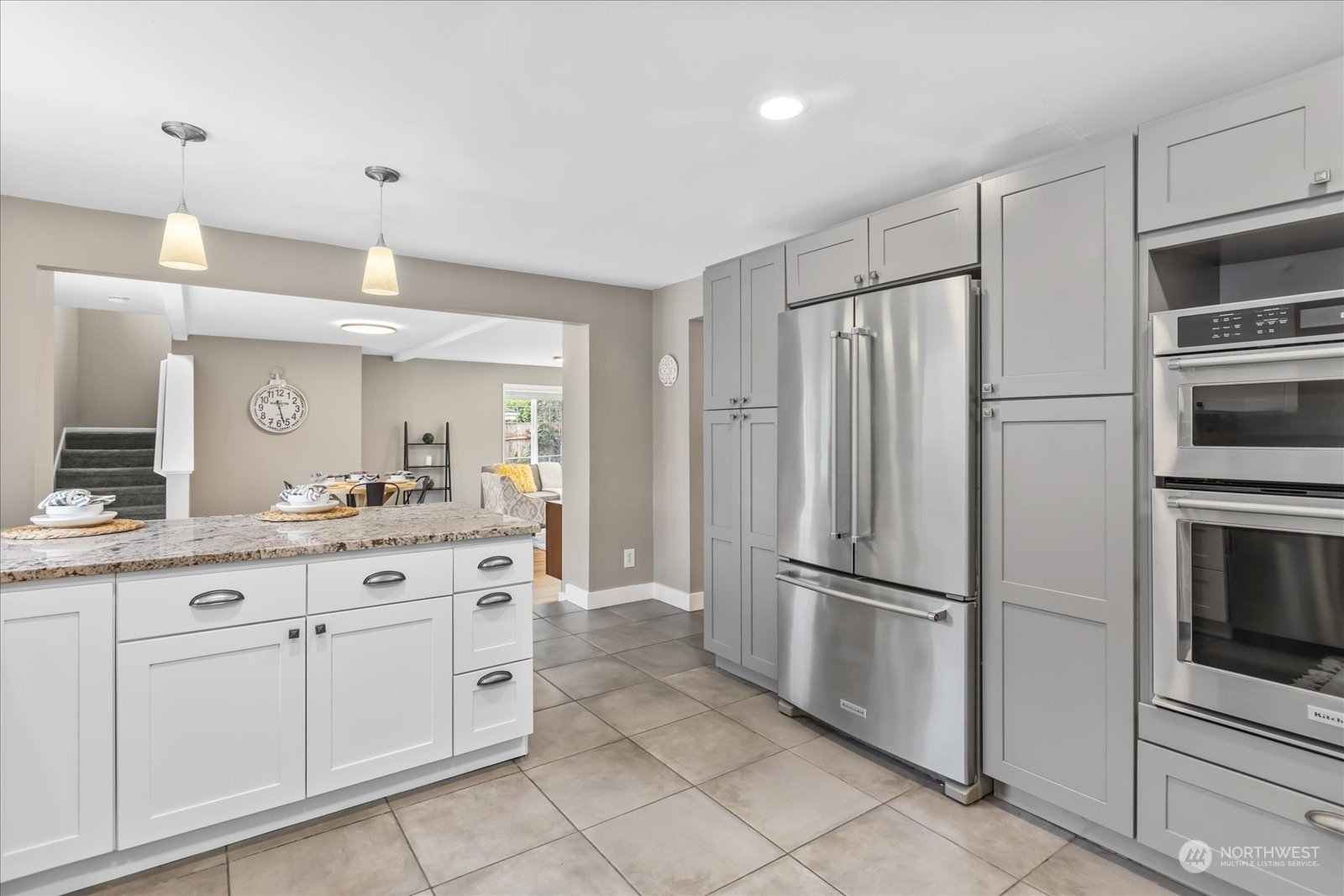 24231 23rd Avenue Southeast Bothell, WA 98021 - Photo 8 of 40 a kitchen with white cabinets and stainless steel appliances