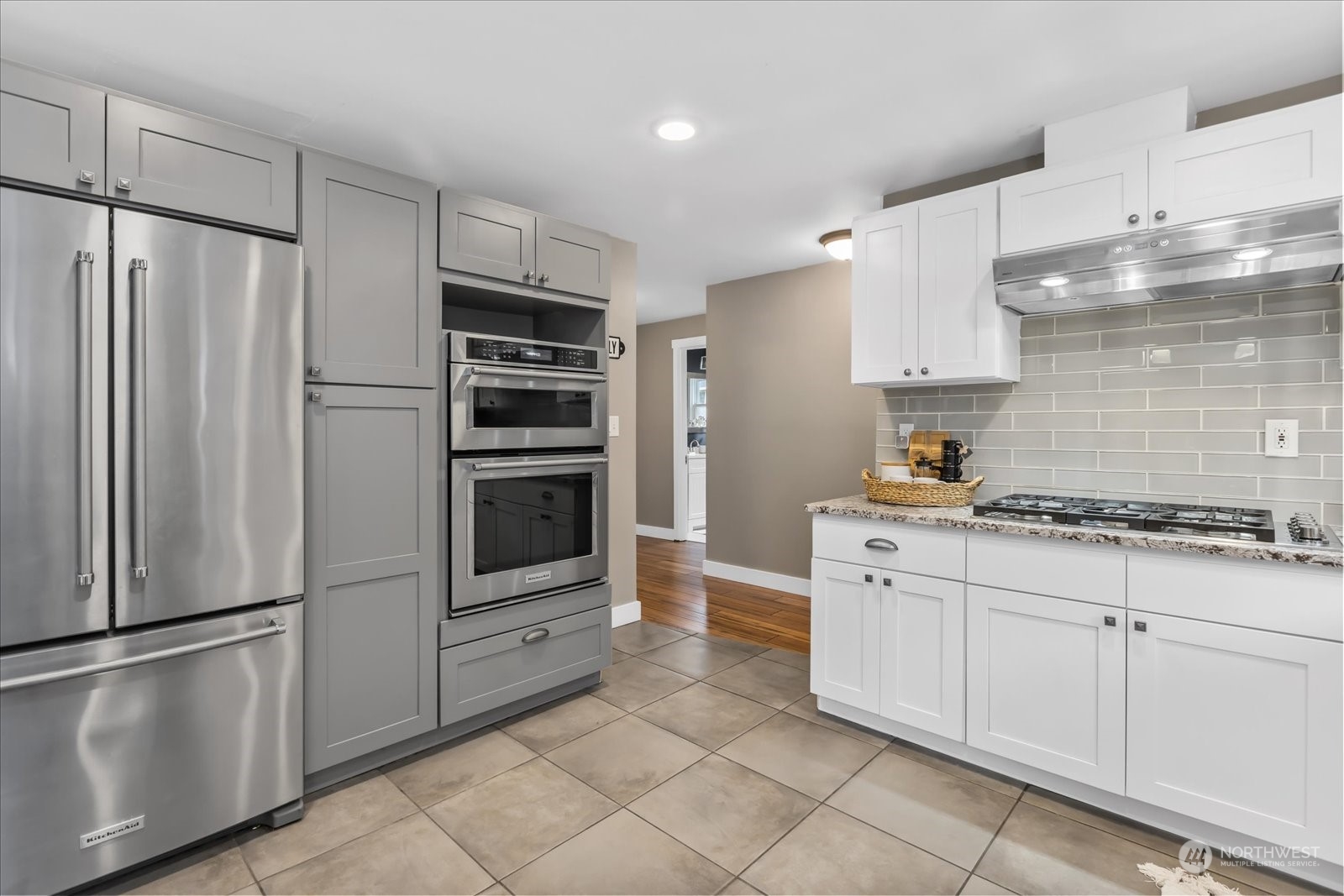 24231 23rd Avenue Southeast Bothell, WA 98021 - Photo 10 of 40 a kitchen with stainless steel appliances a refrigerator sink and cabinets