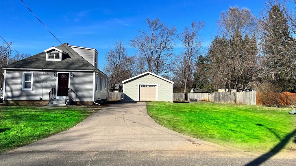 94 Witheridge Street Feeding Hills, MA 01030 - Photo 1 of 24 a front view of a house with a yard and trees
