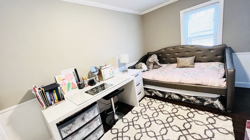 94 Witheridge Street Feeding Hills, MA 01030 - Photo 11 of 24 a bedroom with a bed and a book shelf