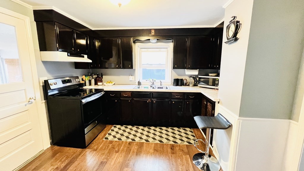 94 Witheridge Street Feeding Hills, MA 01030 - Photo 19 of 24 a kitchen with a sink and a refrigerator