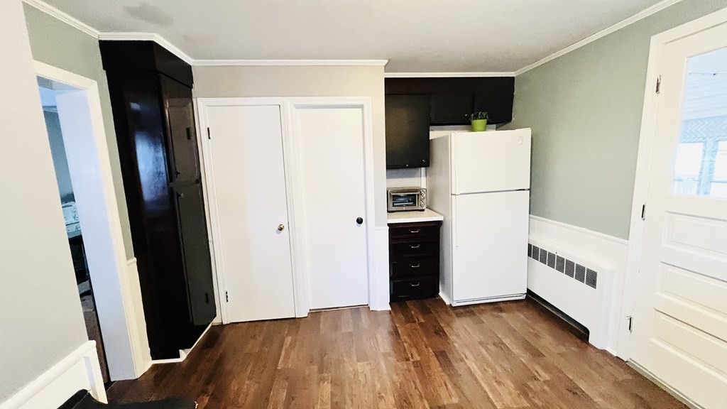 94 Witheridge Street Feeding Hills, MA 01030 - Photo 20 of 24 a view of kitchen with refrigerator and wooden floor