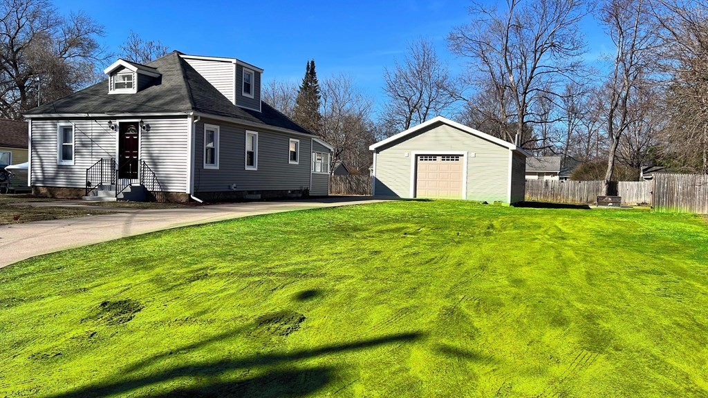 94 Witheridge Street Feeding Hills, MA 01030 - Photo 2 of 24 a front view of a house with a yard and garage