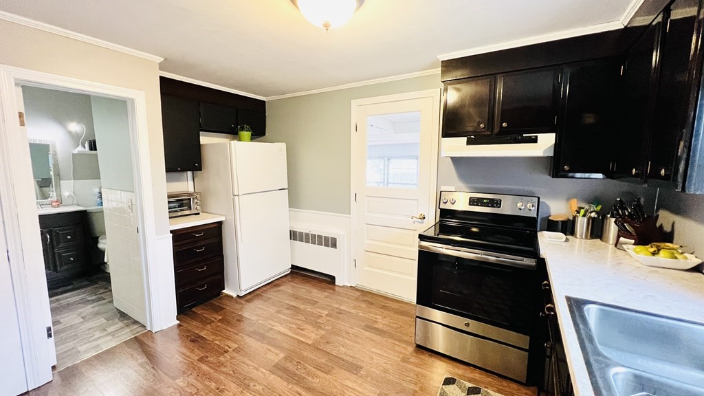 94 Witheridge Street Feeding Hills, MA 01030 - Photo 22 of 24 a kitchen with a refrigerator stove and cabinets
