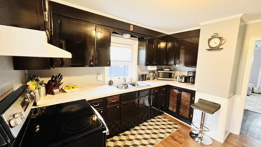 94 Witheridge Street Feeding Hills, MA 01030 - Photo 24 of 24 a kitchen with a sink and cabinets