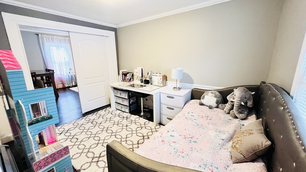 94 Witheridge Street Feeding Hills, MA 01030 - Photo 8 of 24 a bedroom with a bed and a flat screen tv