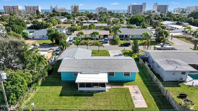 an aerial view of a house with a garden