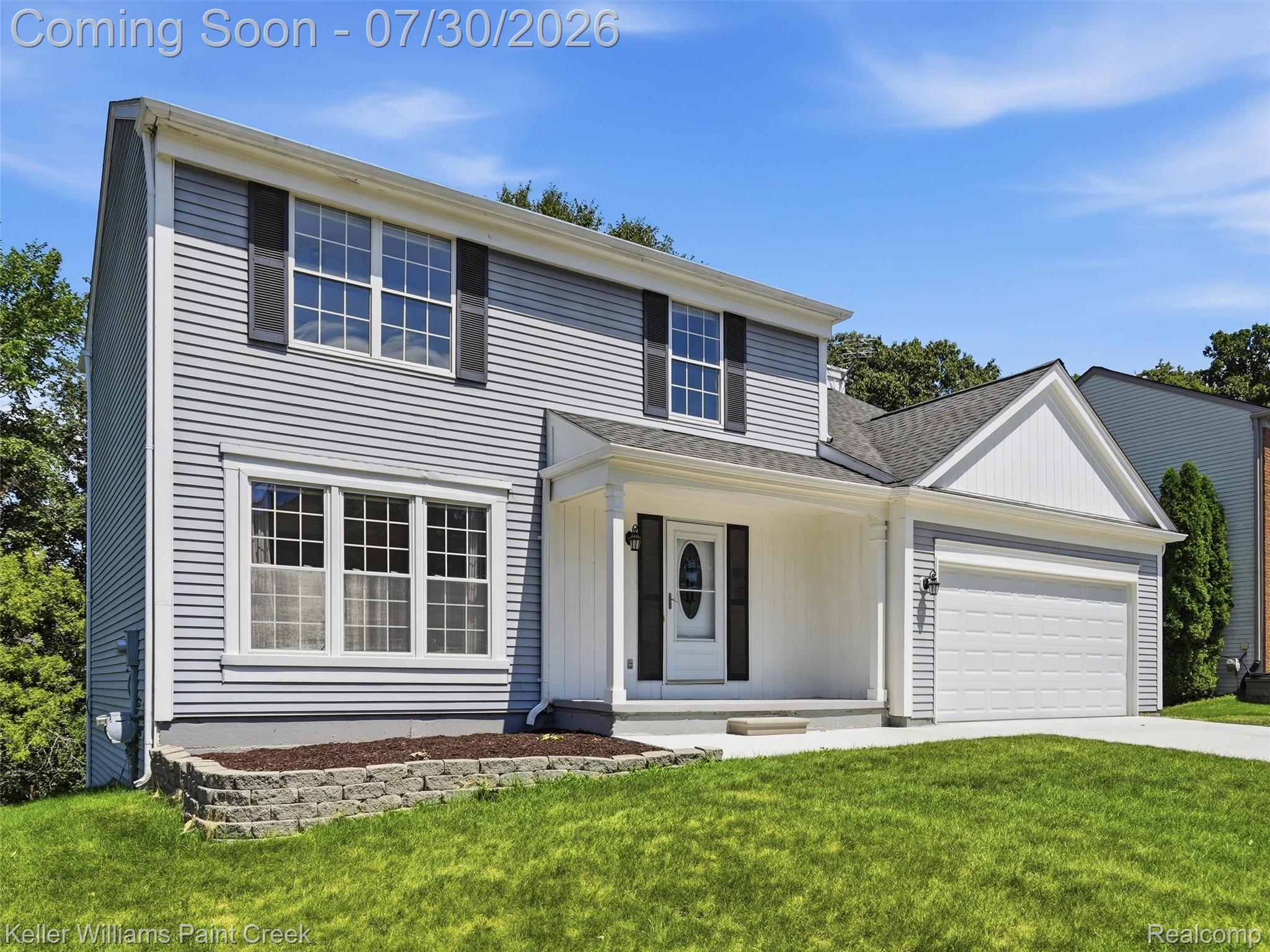 543 Arlington Drive Rochester, MI 48307 - Photo 2 of 59 Two-story residence featuring light gray siding with white trim accents and dark shutters