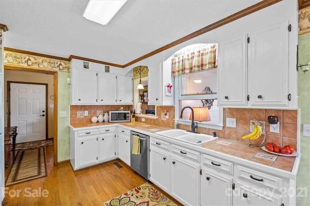 5309 Randolph Road Kannapolis, NC 28081 - Photo 14 of 41 a kitchen with cabinets a sink and appliances