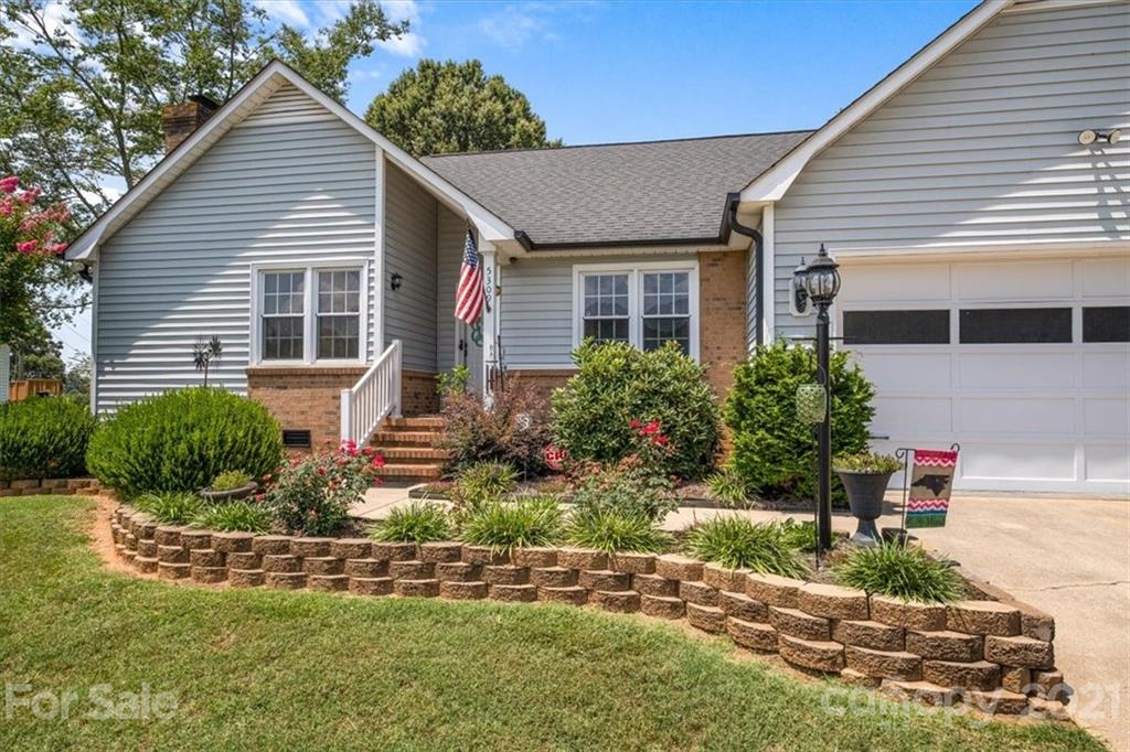 5309 Randolph Road Kannapolis, NC 28081 - Photo 3 of 41 a front view of a house with a yard and potted plants