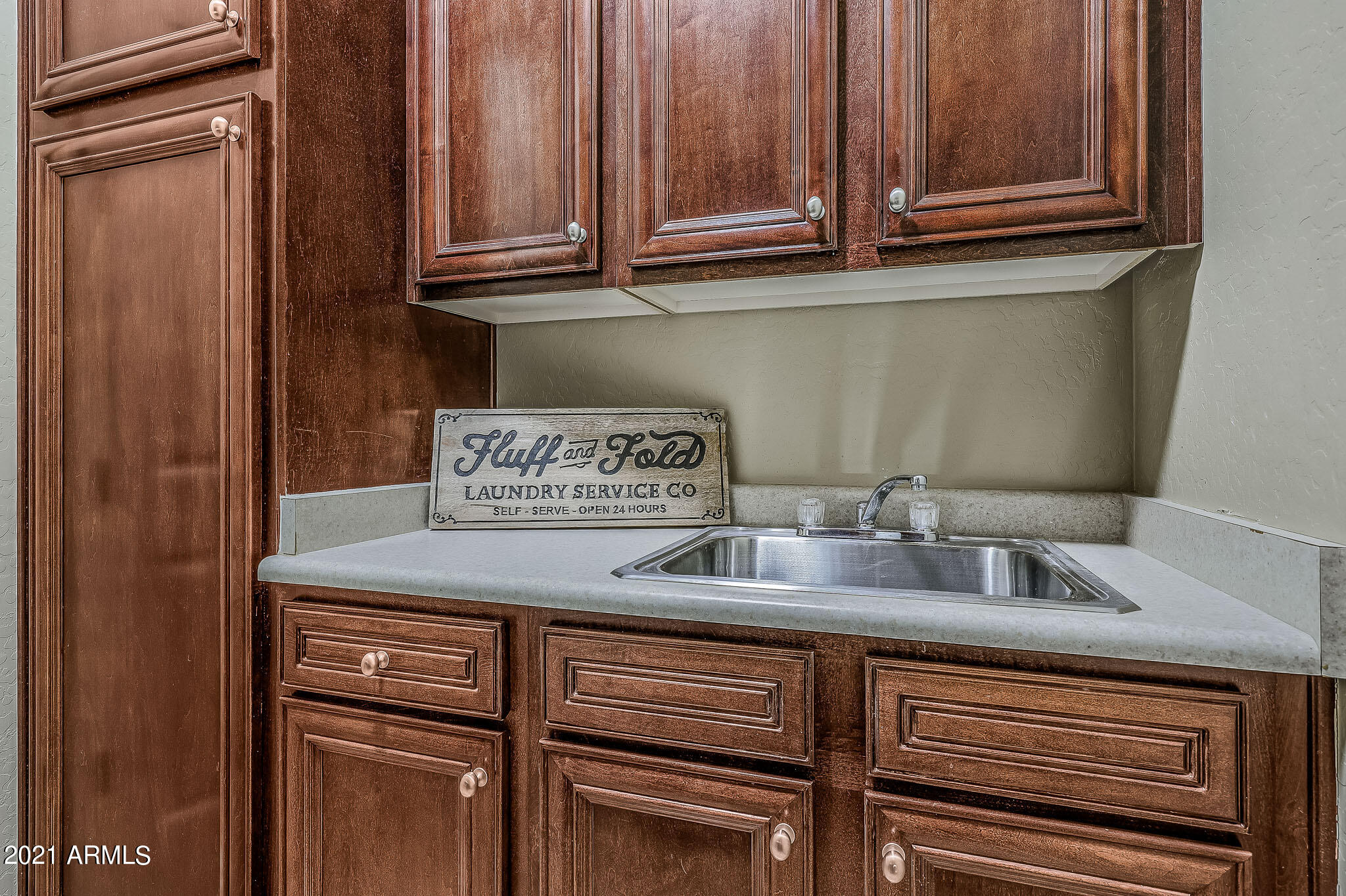 18377 West Piedmont Road Goodyear, AZ 85338 - Photo 29 of 68 Laundry Room sink & storage