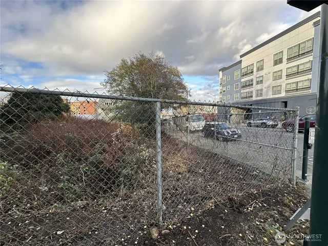 a view of roof deck with wooden fence