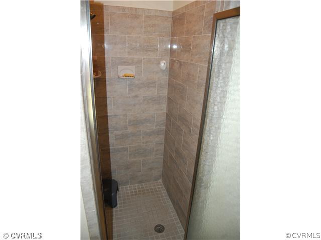13620 Thorngate Road Midlothian, VA 23113 - Photo 10 of 12 a bathroom with a shower