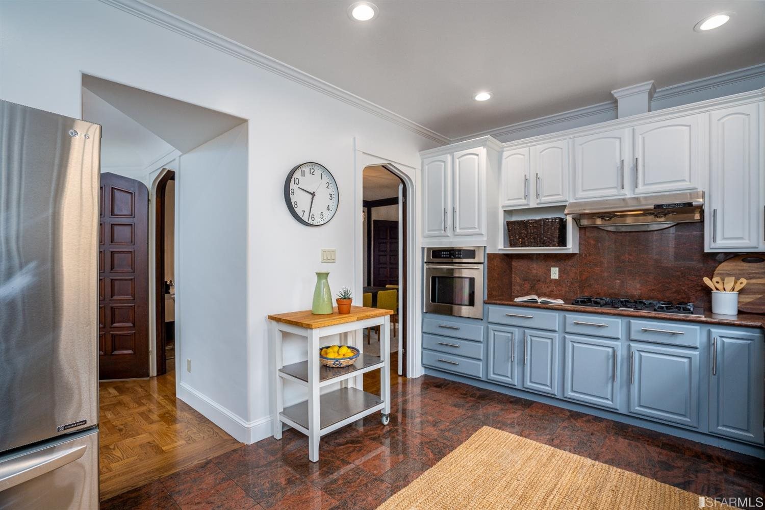 369 Pacheco Street San Francisco, CA 94116 - Photo 12 of 49 a kitchen with stainless steel appliances granite countertop a refrigerator and a stove top oven