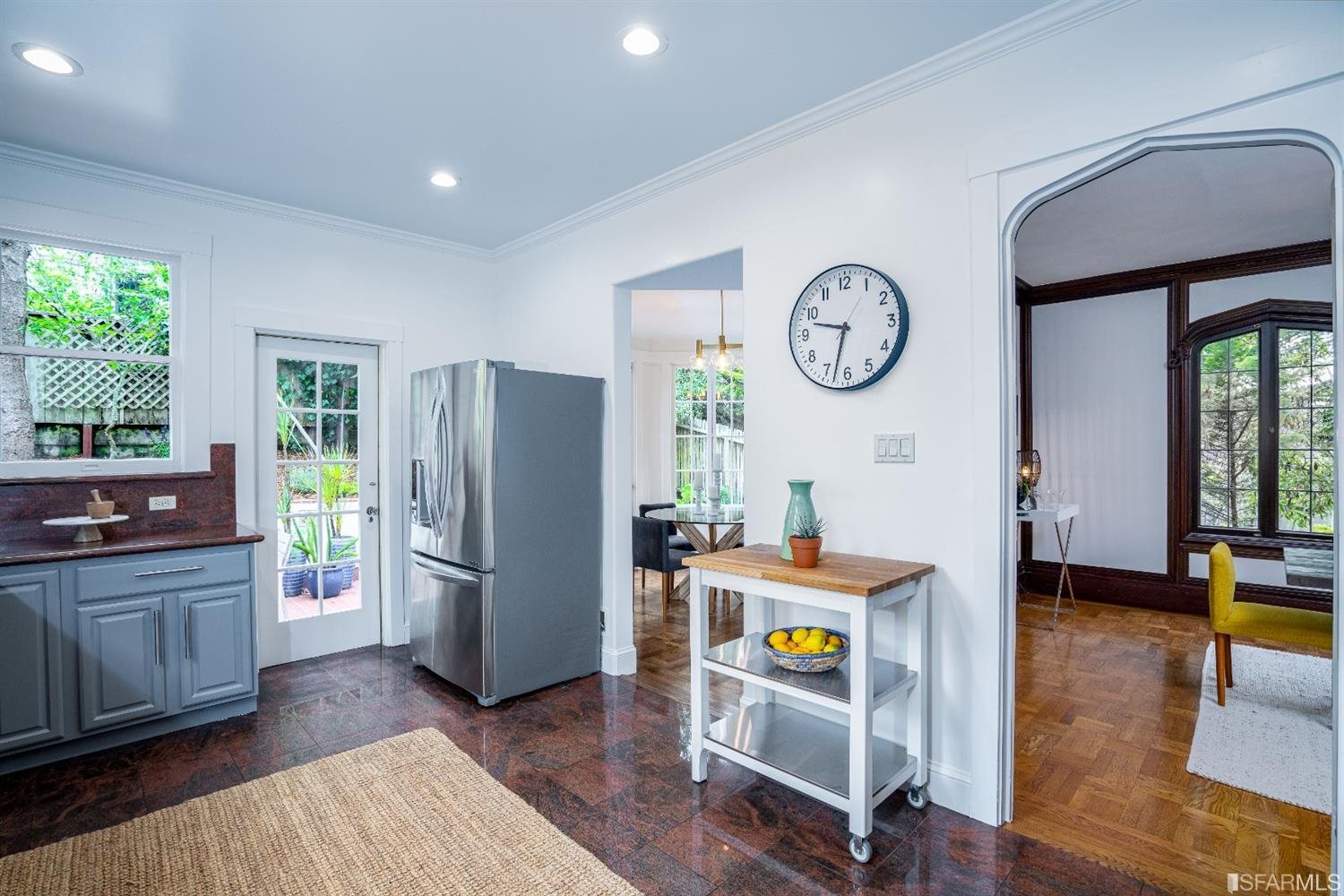 369 Pacheco Street San Francisco, CA 94116 - Photo 13 of 49 a view of a kitchen with fridge and wooden floor