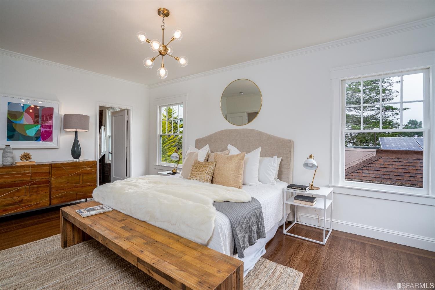 369 Pacheco Street San Francisco, CA 94116 - Photo 19 of 49 a bedroom with a bed and wooden floor
