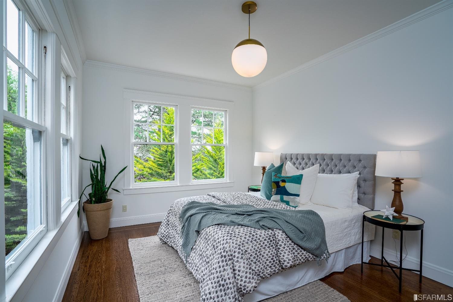 369 Pacheco Street San Francisco, CA 94116 - Photo 23 of 49 a bedroom with a bed and a large window