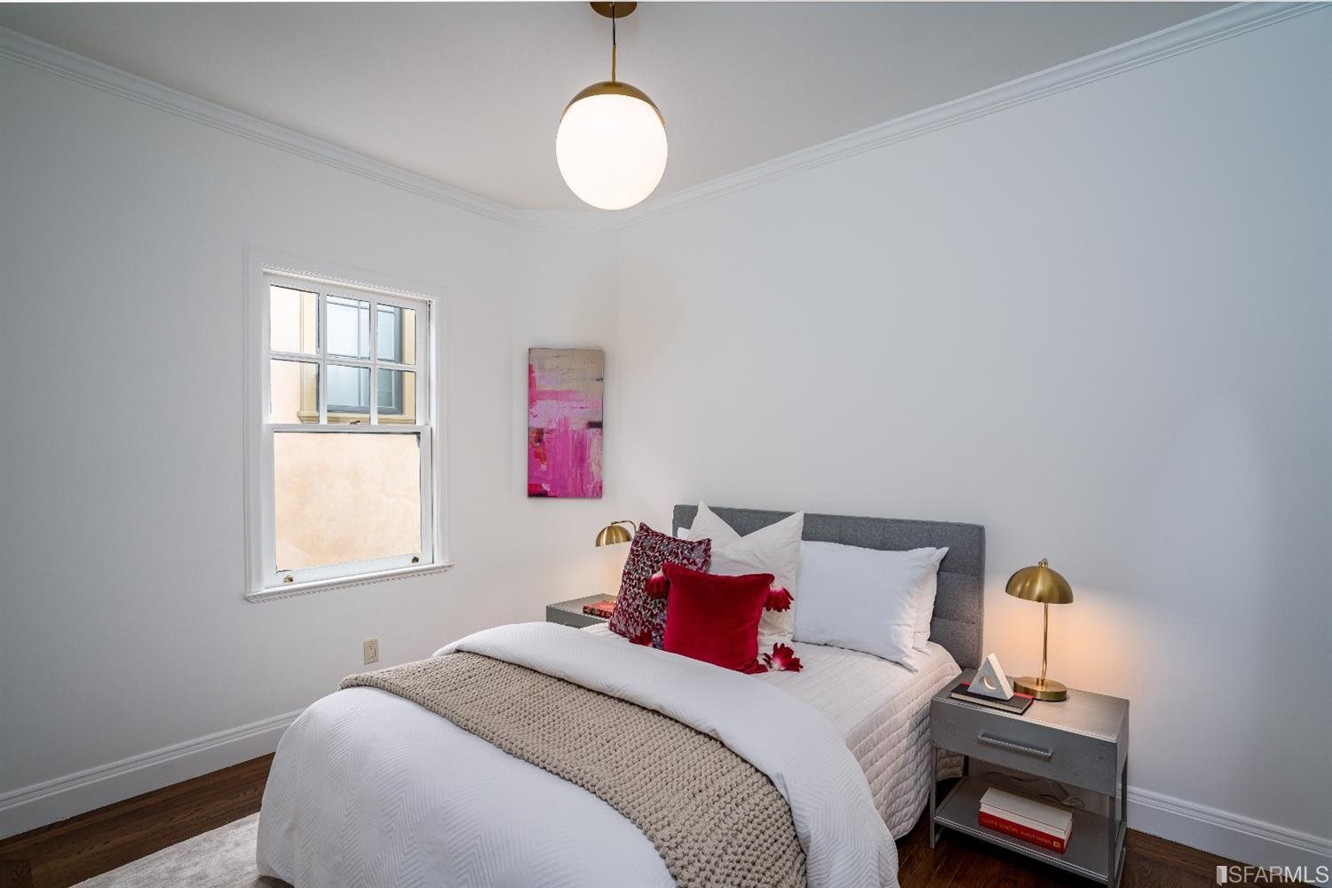 369 Pacheco Street San Francisco, CA 94116 - Photo 25 of 49 a bedroom with a bed and a window